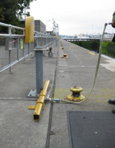 fall restraint mechanism mounted on concrete