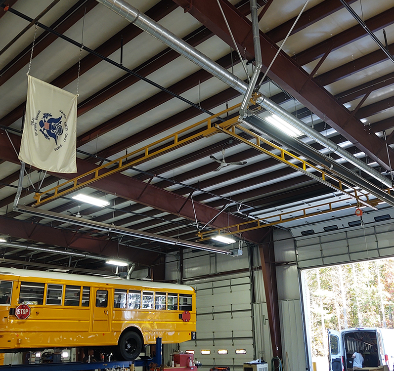 yellow anchor tracks suspended in large garage